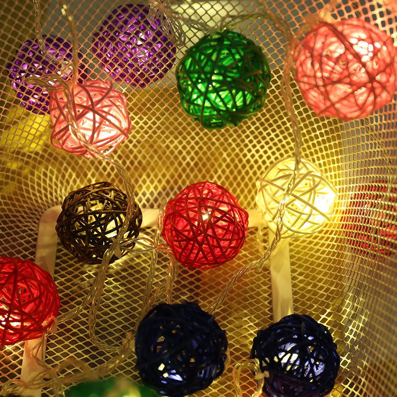 Woven Rattan Globe Lights lit at night