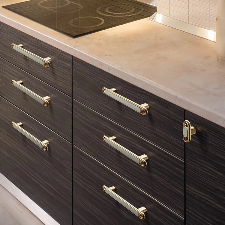 Gold Zinc Alloy Bar Pulls on dark kitchen cabinetry