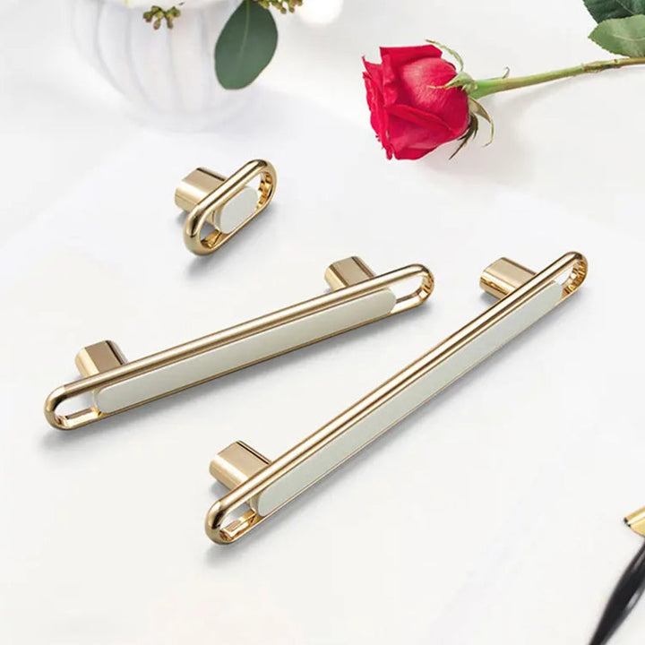 Gold Zinc Alloy Bar Pulls styled lifestyle with flowers