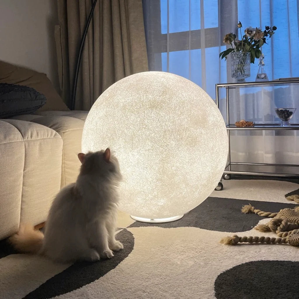 White Sculptural Moon Resin Lamp glowing lifestyle