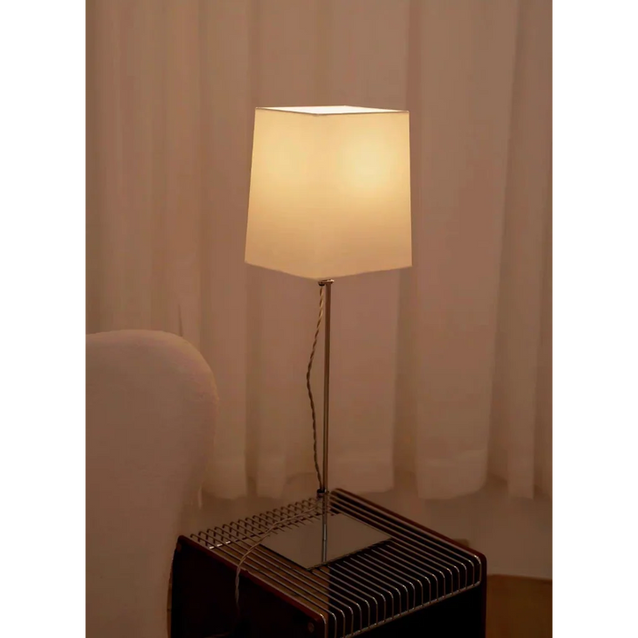 French Old Money Table Lamp lit on side table