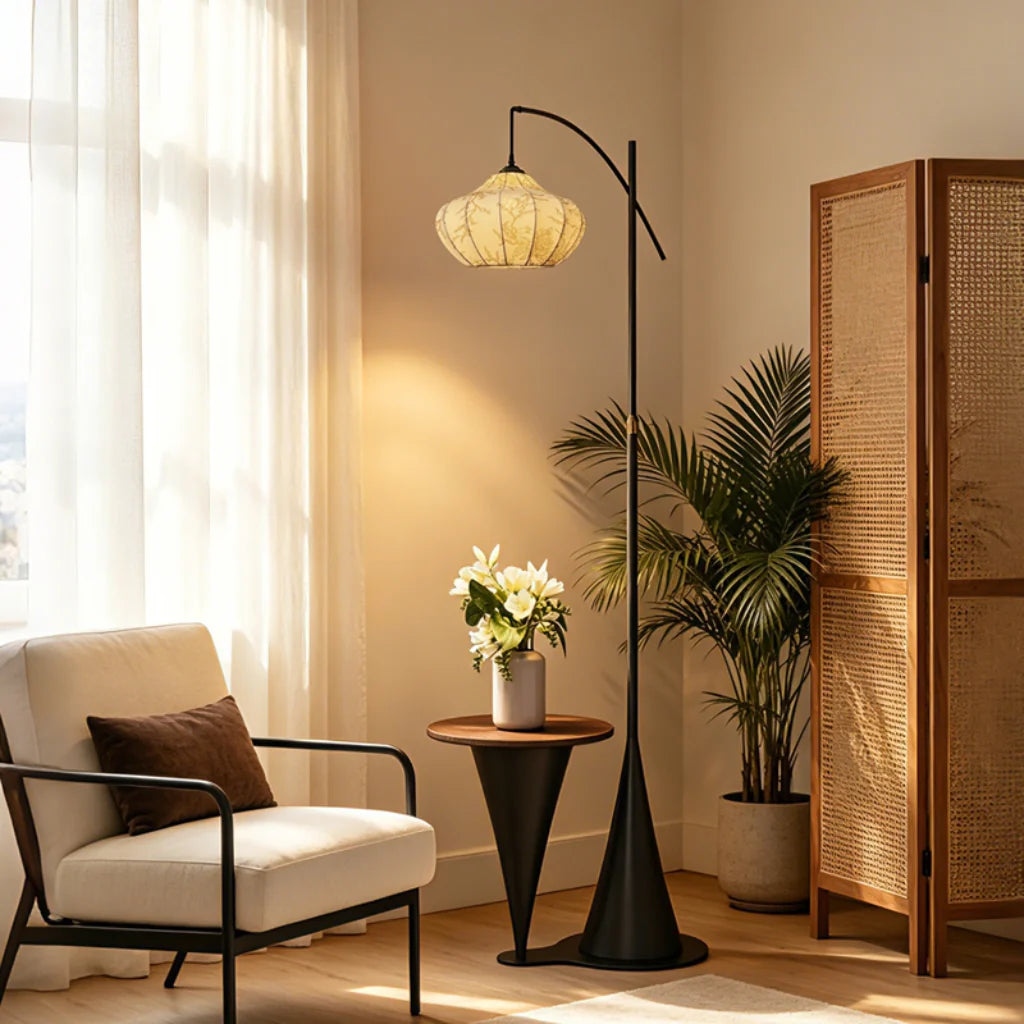 Artisan Wood Floor Lamp glowing warm white in a living room