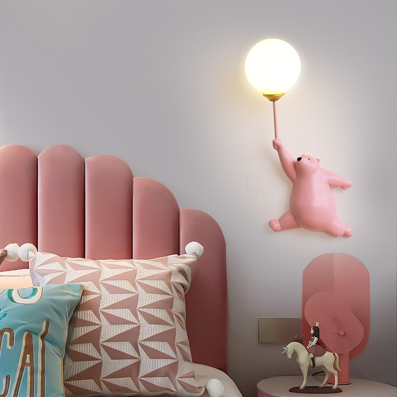 Pink Resin Bear Balloon Wall Lamp lit at night