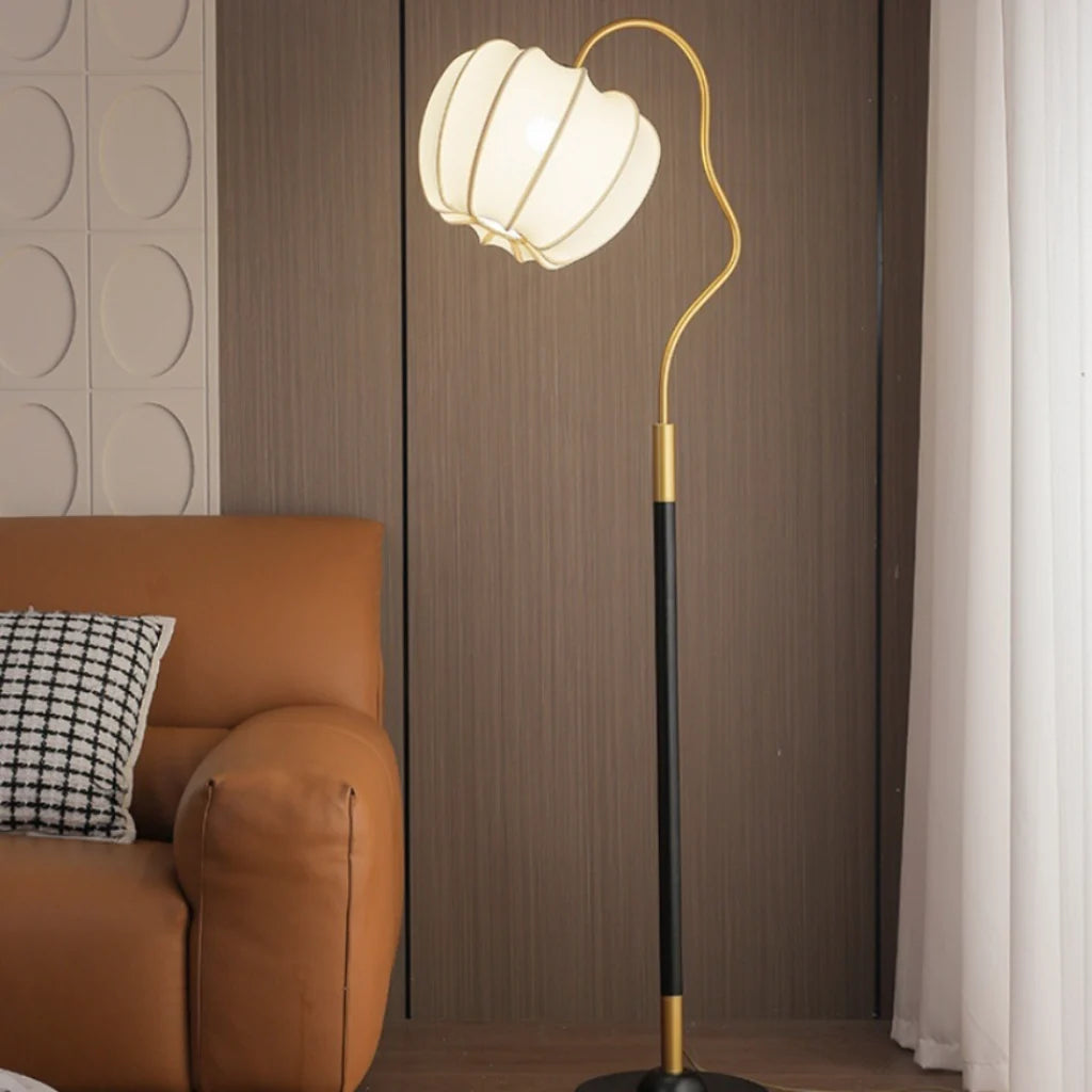 French Retro Floor Lamp lit lifestyle by leather sofa