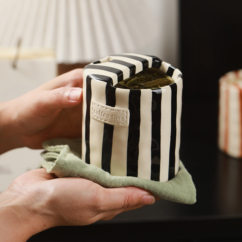 Black Retro Striped Ceramic Mug held in both hands