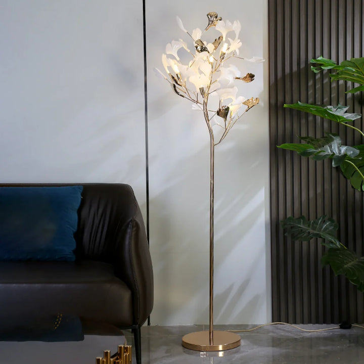 French Gold Ginkgo Leaf Floor Lamp by leather sofa