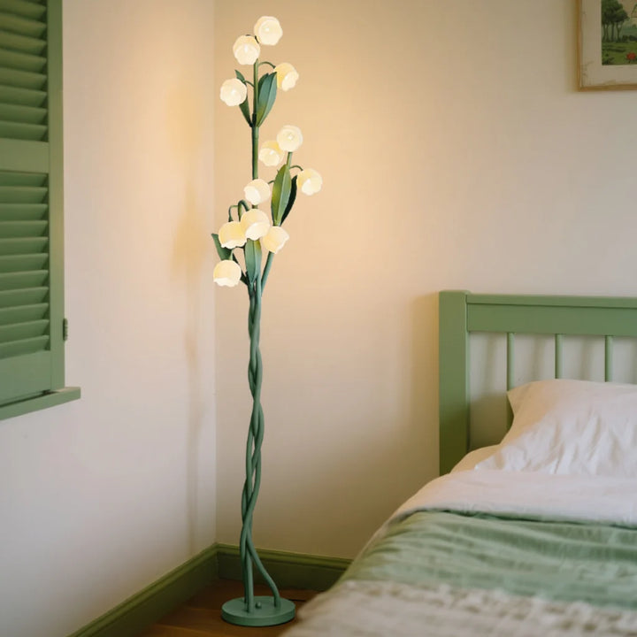 Lily Bloom Acrylic Floor Lamp with flower-shaped LED shade in a living room