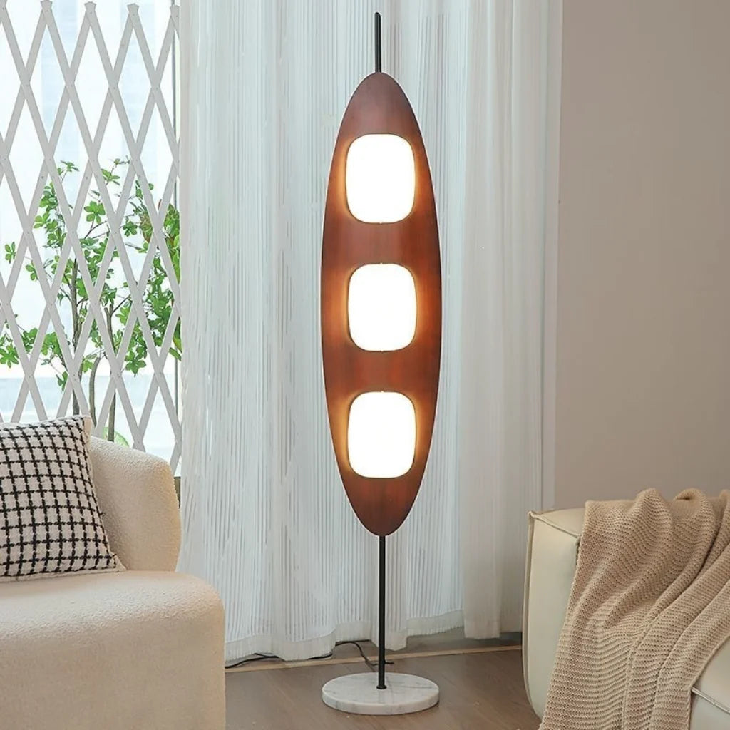 Walnut Yacht Silhouette Floor Lamp - lit ambient glow in living room