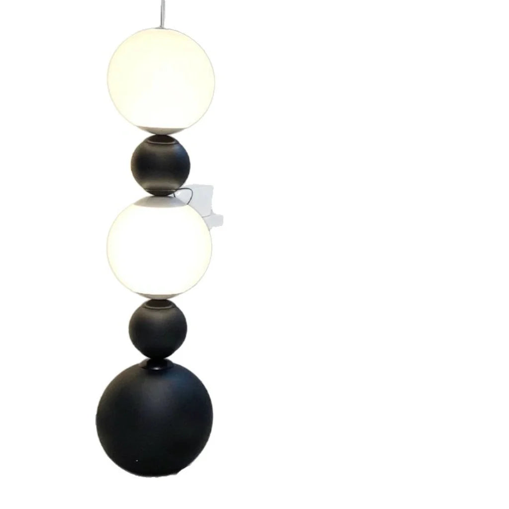 Black Metal 3-Globe Floor Lamp beside sofa lifestyle