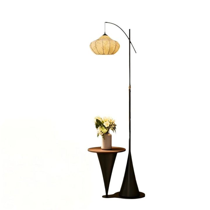 Artisan Wood Floor Lamp shown beside a sofa in a styled room