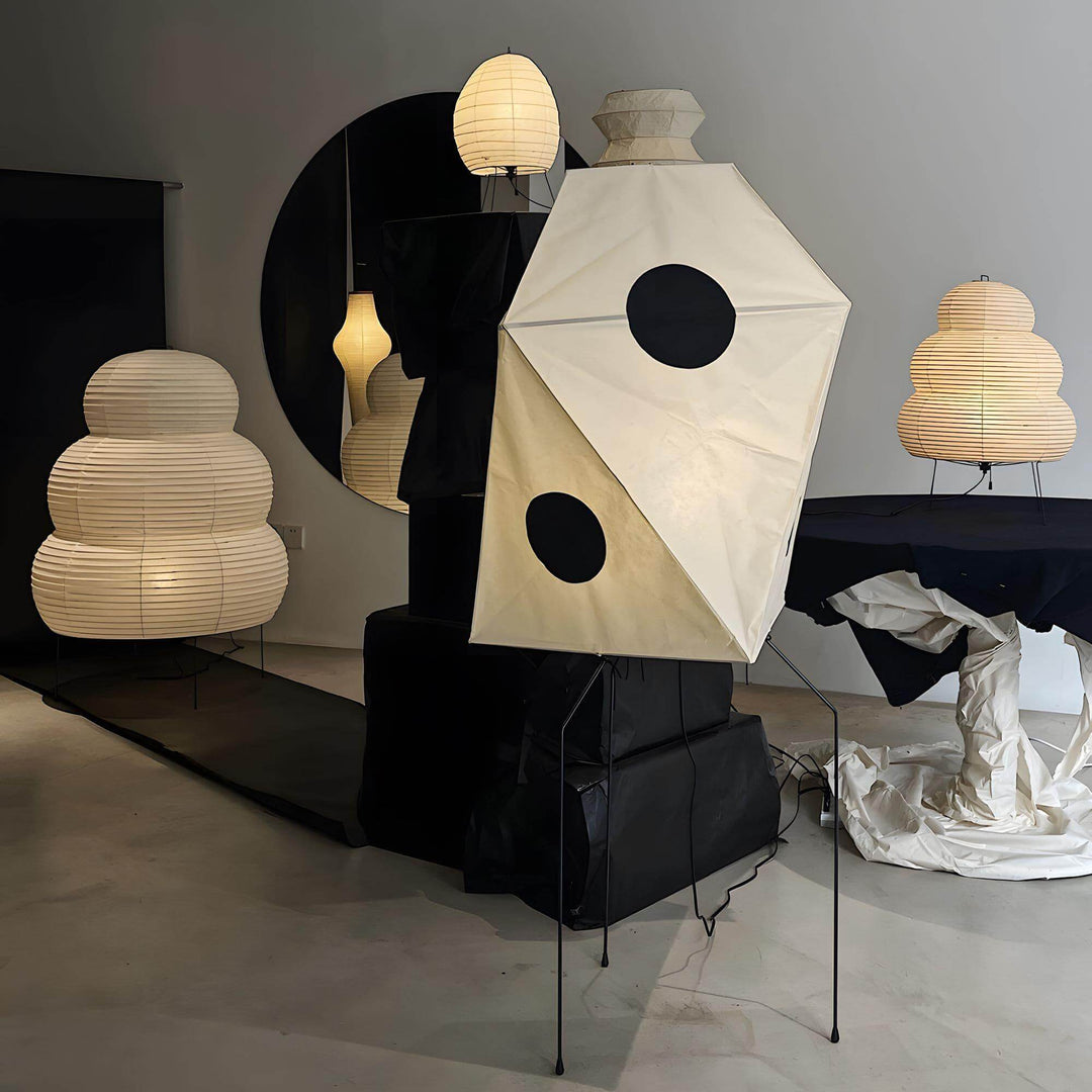 Modern white rice paper floor lamps showcasing minimalist Japanese design in a stylish interior setting.
