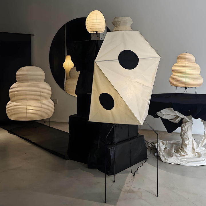 Modern white rice paper floor lamps showcasing minimalist Japanese design in a stylish interior setting.