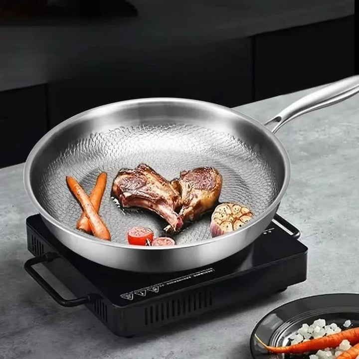 Stainless Steel Hammered Skillet cooking meat and vegetables