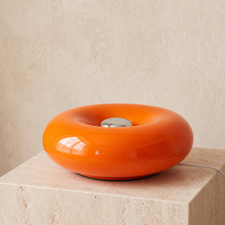 Pink Round Sculptural Table Lamp glowing