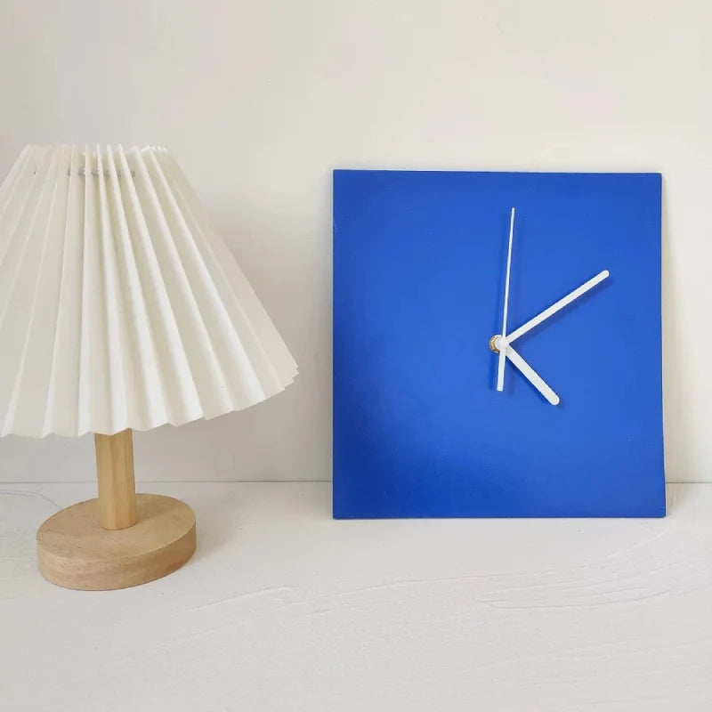 Square Klein Blue Geometric Wall Clock displayed next to table lamp lifestyle