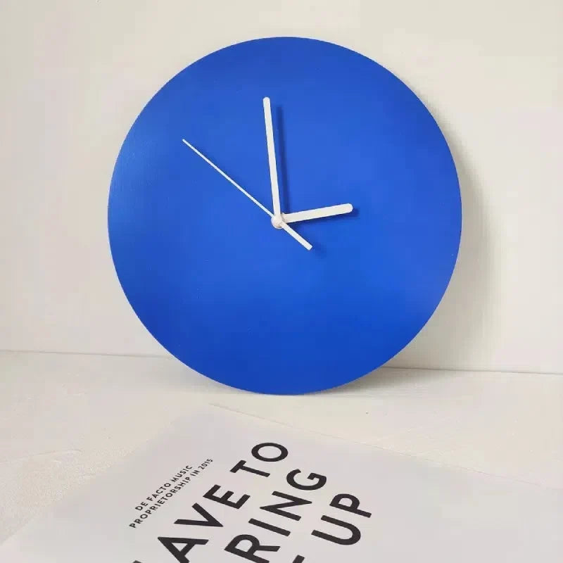 Round Klein Blue Geometric Wall Clock leaning against wall lifestyle