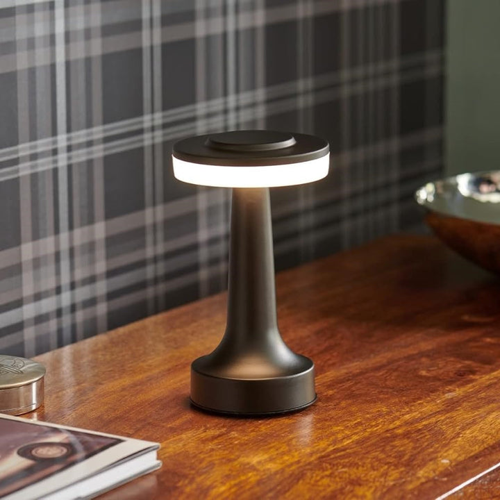 Black Wireless Retro Table Lamp lit at dusk