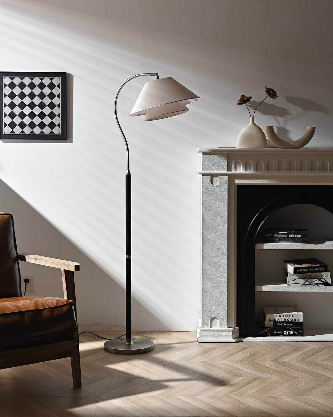 Nelke wooden curved floor lamp over a sofa, minimalist design, ideal for modern interiors.