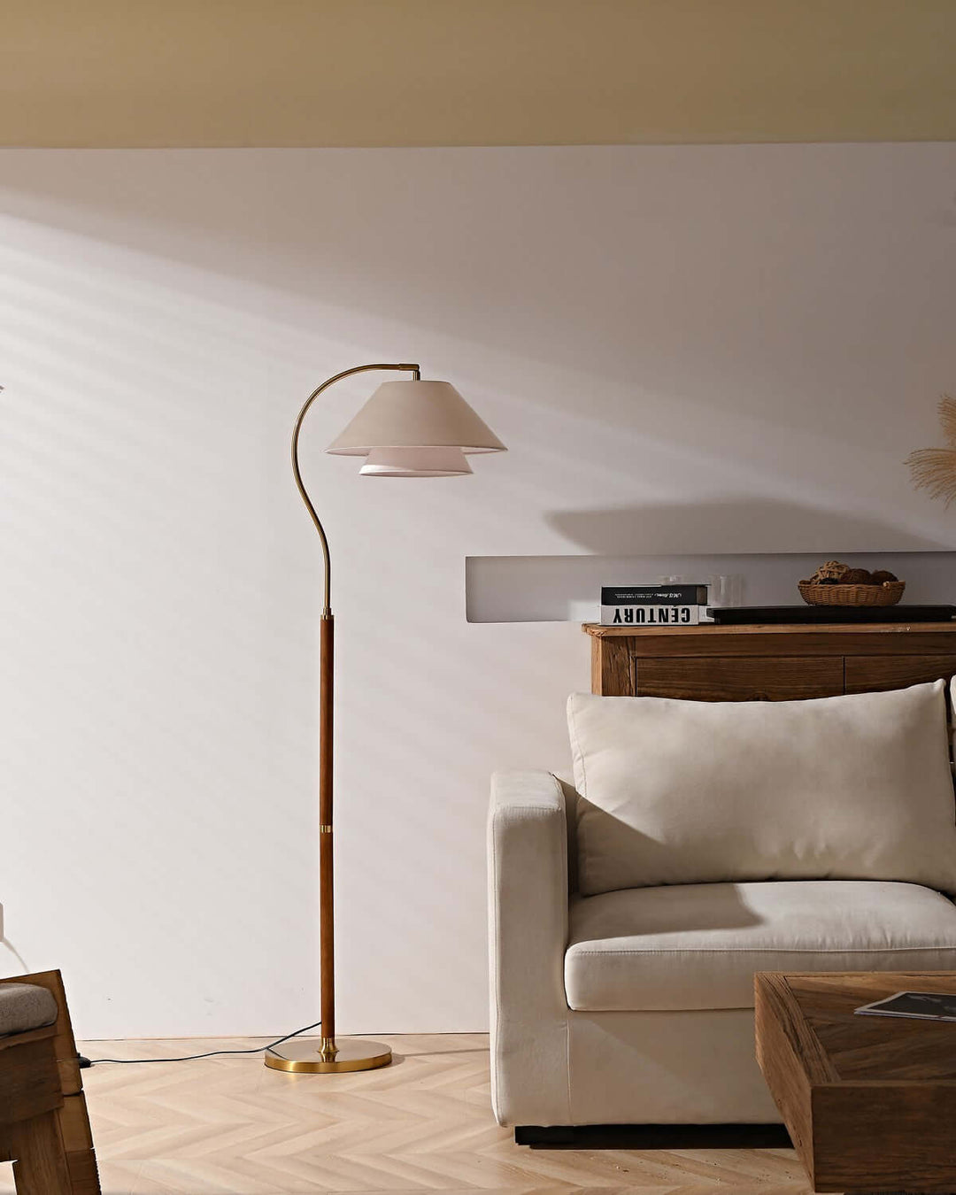 Nelke floor light, a minimalist wooden lamp with curved design, perfect for over a sofa, enhancing modern living spaces.