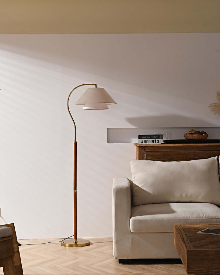 Nelke floor light, a minimalist wooden lamp with curved design, perfect for over a sofa, enhancing modern living spaces.