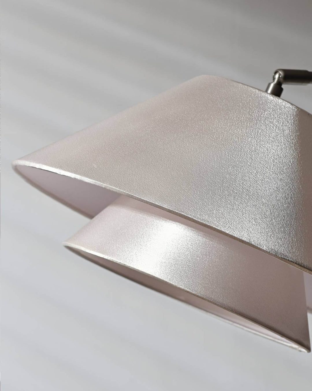 Close-up of a modern cylindrical lamp shade with a textured finish, perfect for minimalist or modern decor.