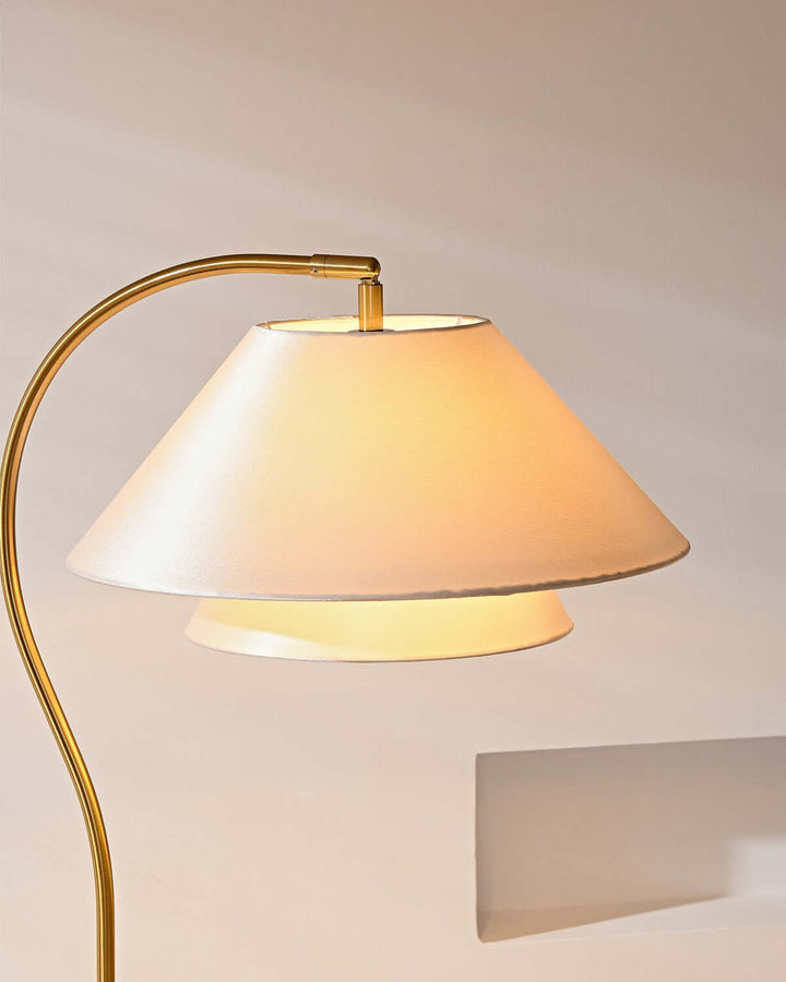Elegant wooden curved floor lamp with a minimalist design, perfect for placing over a sofa.