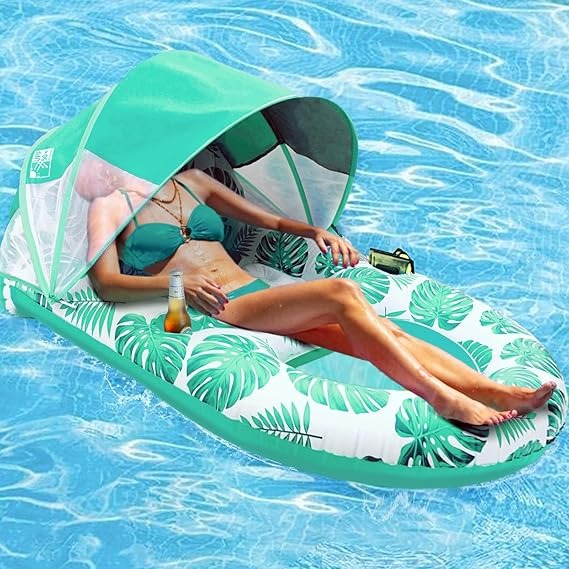 Green leaf-print Canopy Pool Lounge Float in use with canopy raised