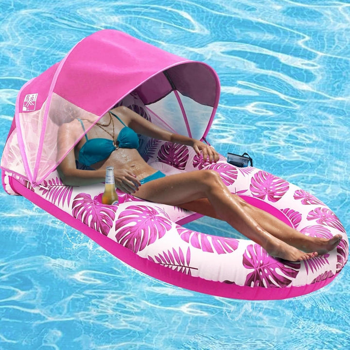 Pink leaf-print Canopy Pool Lounge Float in use with canopy raised