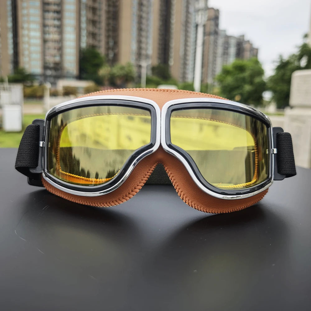 Vintage Motorcycle Riding Goggles on a motorcycle handlebar