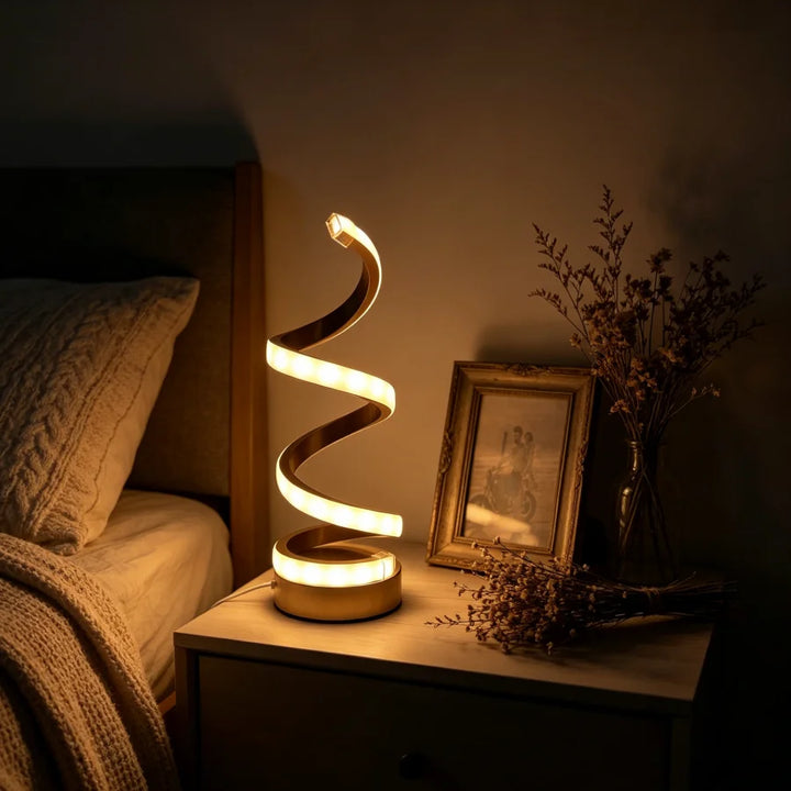 Gold Spiral Desk Lamp lit neutral white glow