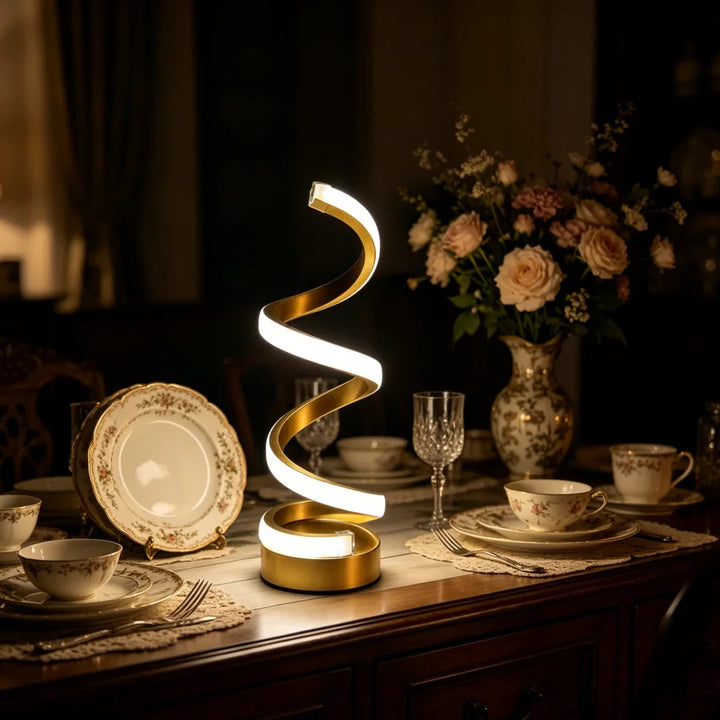 Gold Spiral Desk Lamp lit cool white glow