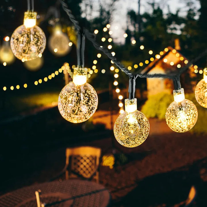 Solar Twinkle Lights glowing outdoors at night
