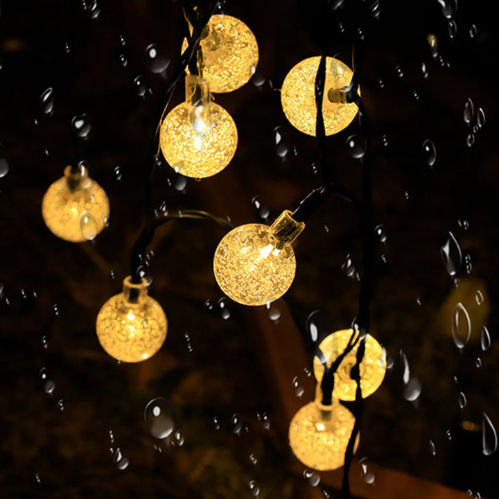 Solar Twinkle Lights draped on garden fence