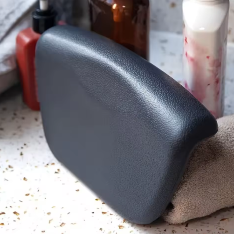 Charcoal Slate Contoured Silicone Bath Pillow with folded towel