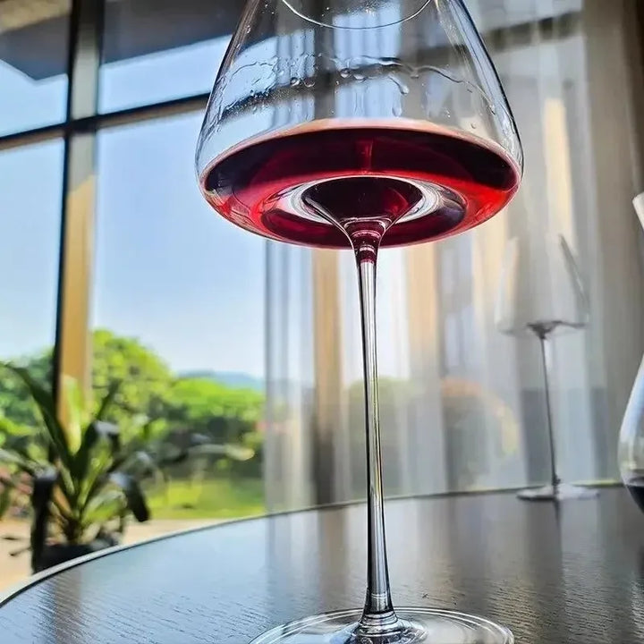 Fluted Crystal Burgundy Wine Glasses filled with red wine