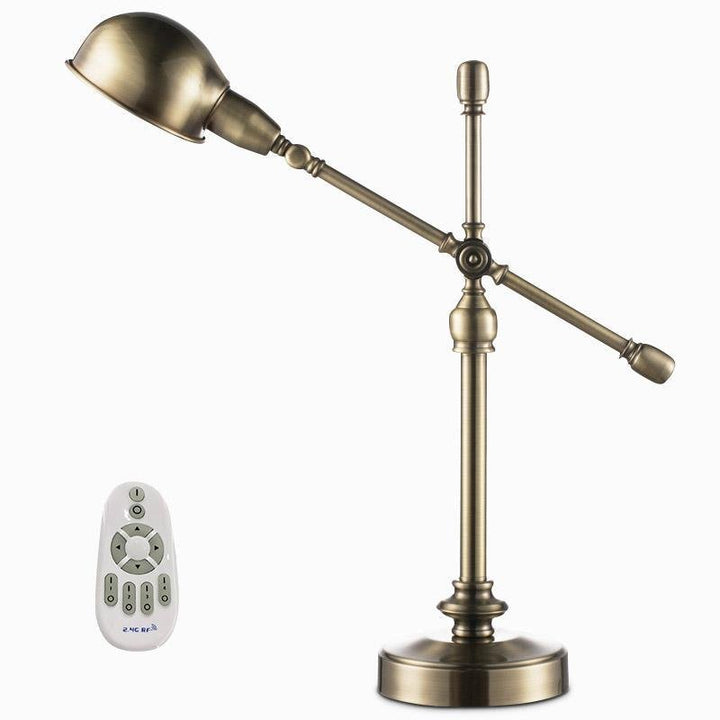 Antique brass desk lamp with dome shade, side angle