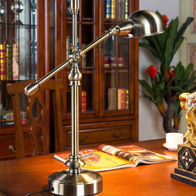 Antique brass desk lamp with pivoting metal shade