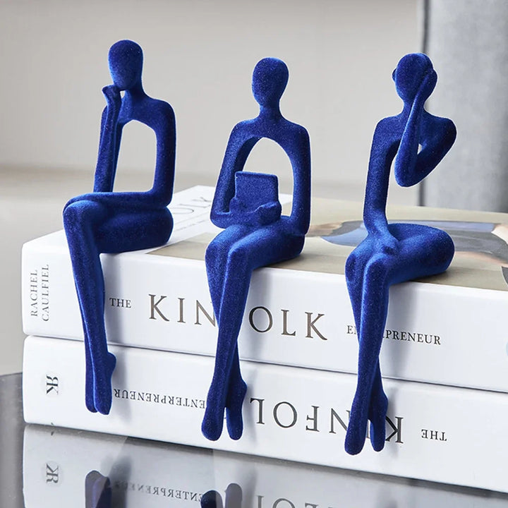 Blue Abstract Thinker Shelf Sitter Figurines on books