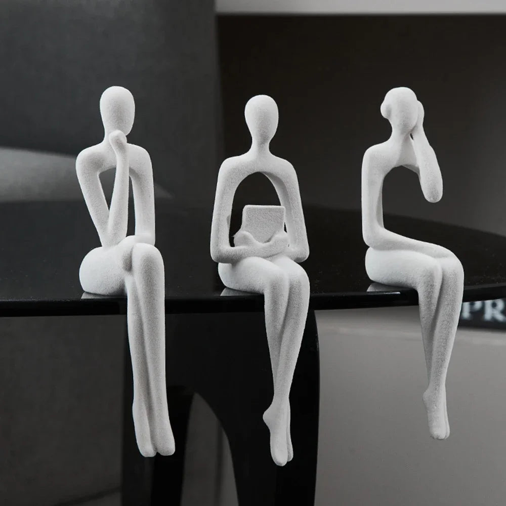 Off-White Abstract Thinker Shelf Sitter Figurines on table edge