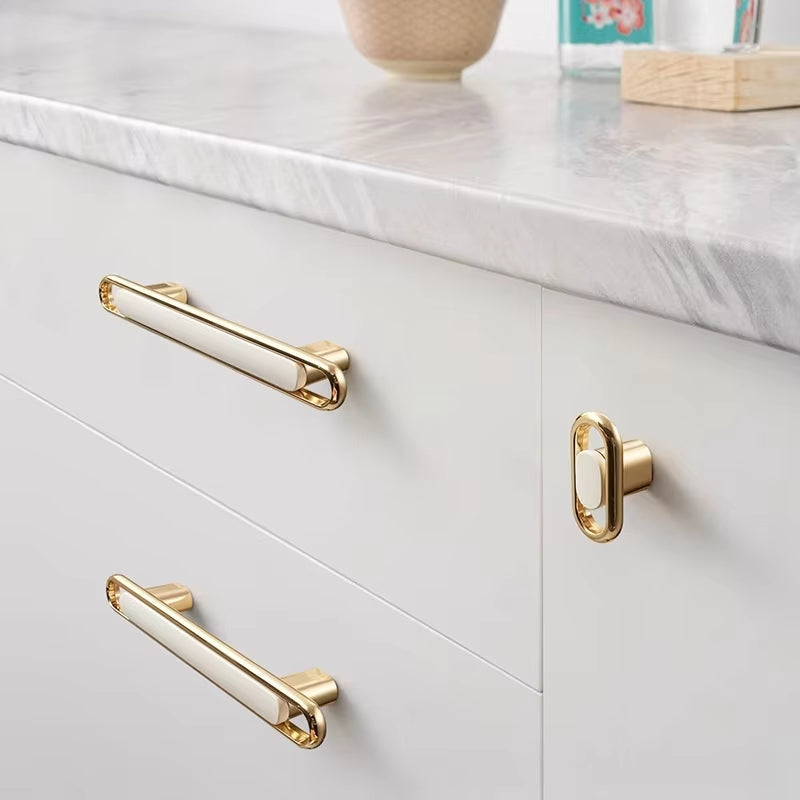 Gold Zinc Alloy Bar Pulls on white kitchen drawers