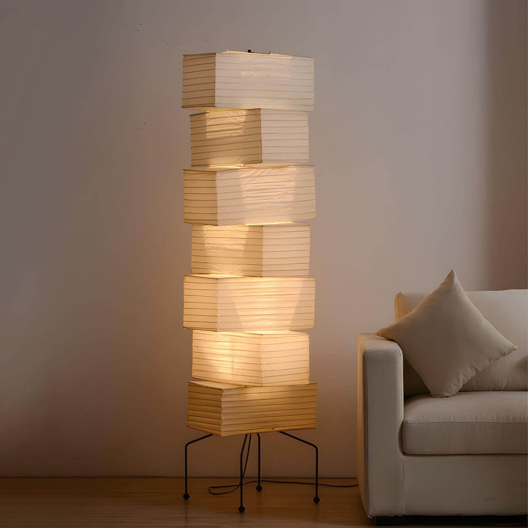 Akari UF4-L10 floor lamp with ribbed rectangular paper shades beside a white sofa
