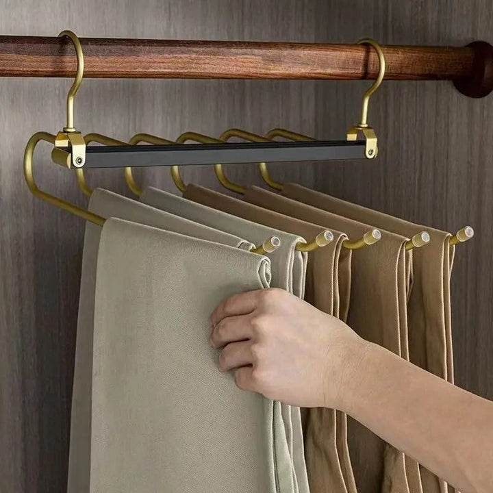 Gold with Black Aluminum Pants Hanger with trousers in closet