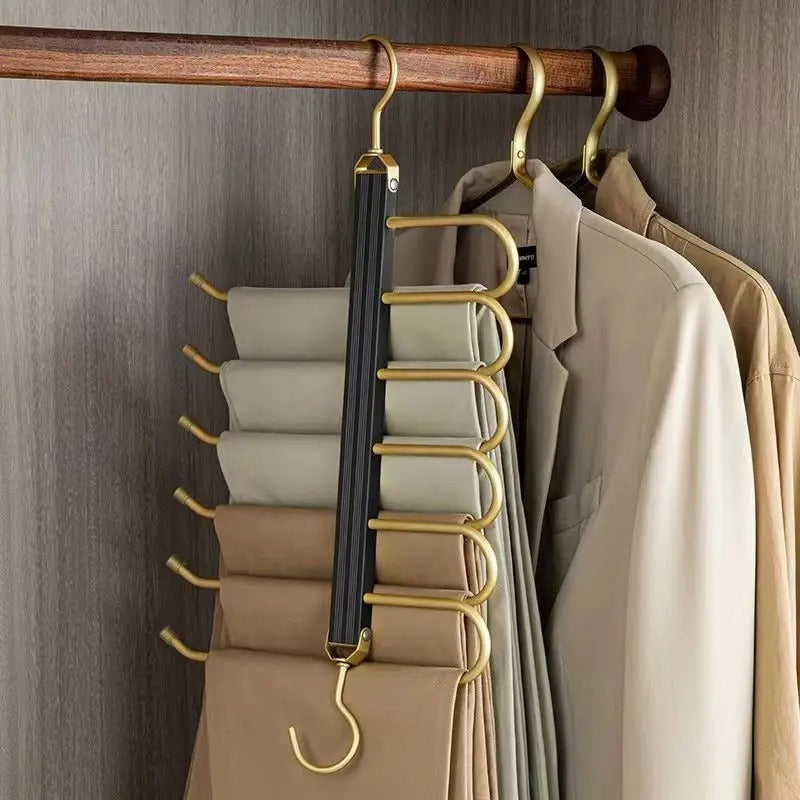 Gold with Black Aluminum Pants Hanger folded in closet