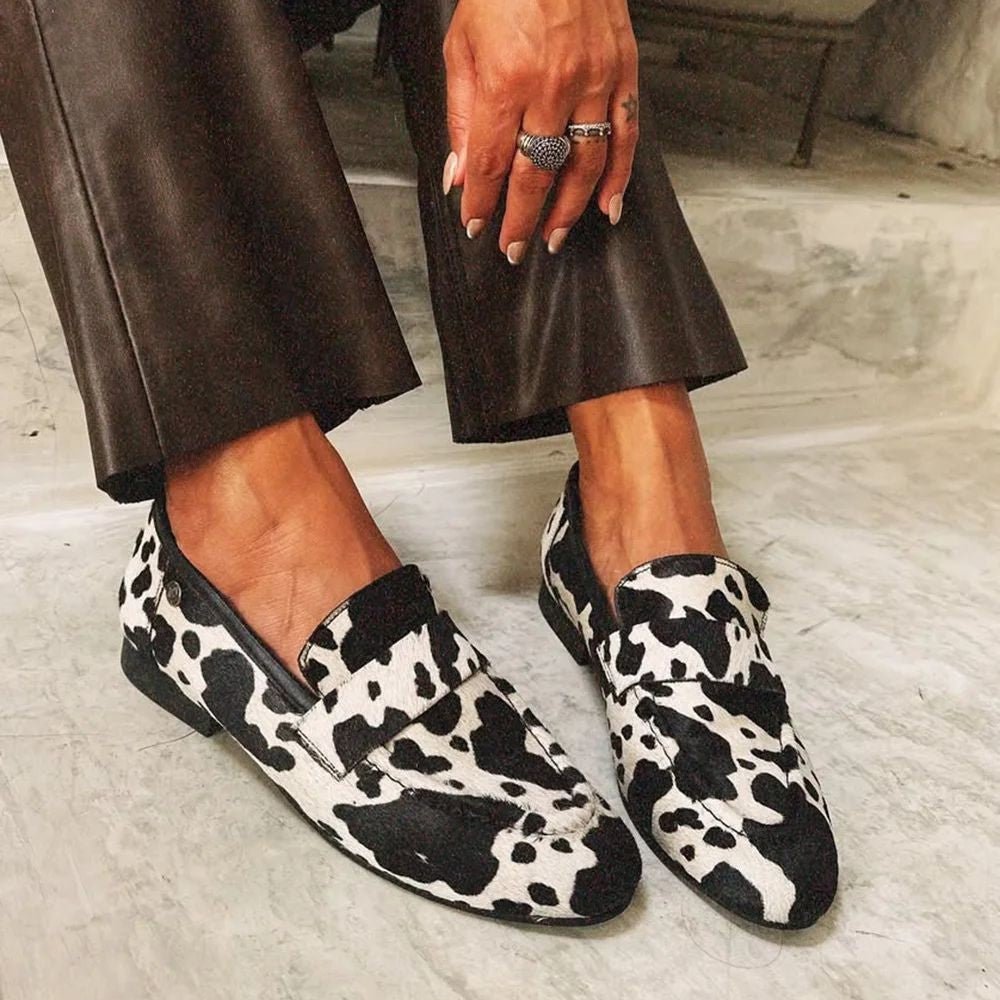 Black and White Animal Print Loafers worn with leather trousers