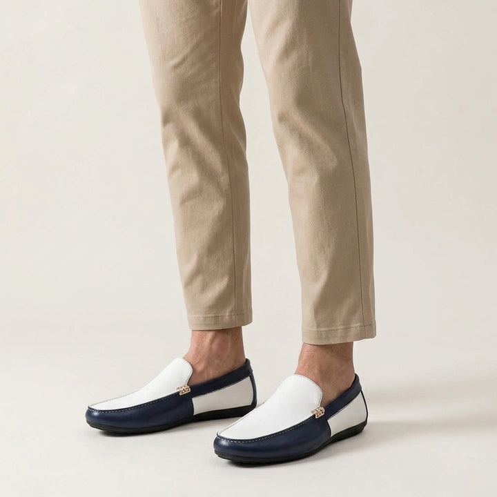 Two-tone vegan leather loafers styled on foot