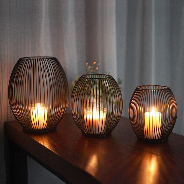 Black Iron Wire Lantern Candle Holders three sizes lit on table
