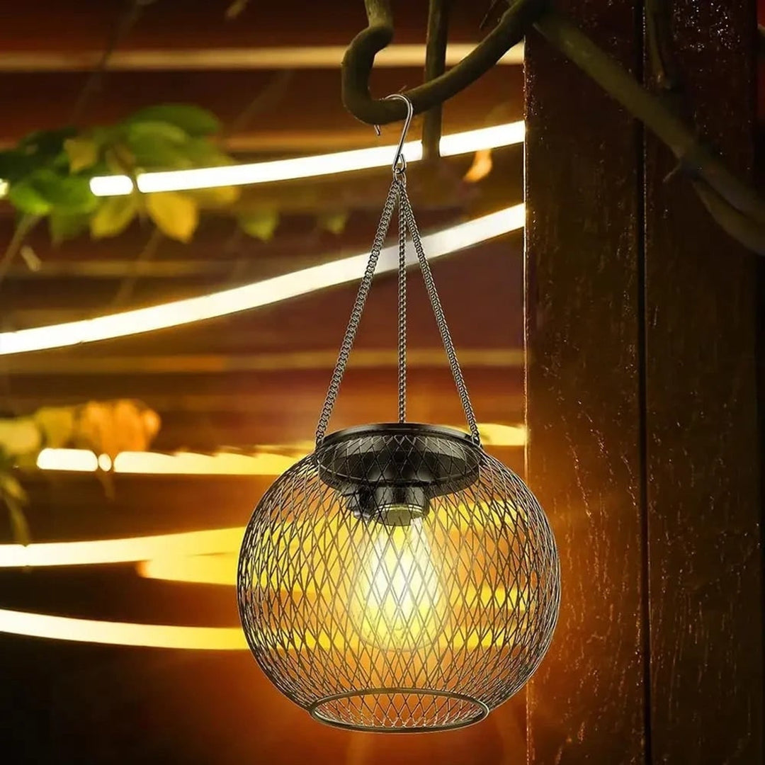 Black metal solar lantern close-up showing diamond wire mesh pattern