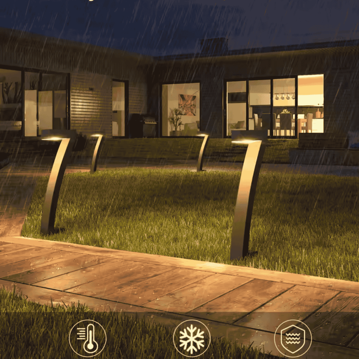Black Solar Pathway Lights along lawn edge at dusk
