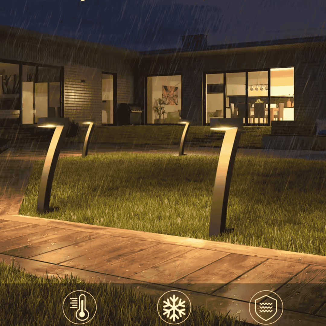 Black Solar Pathway Lights along lawn edge at dusk