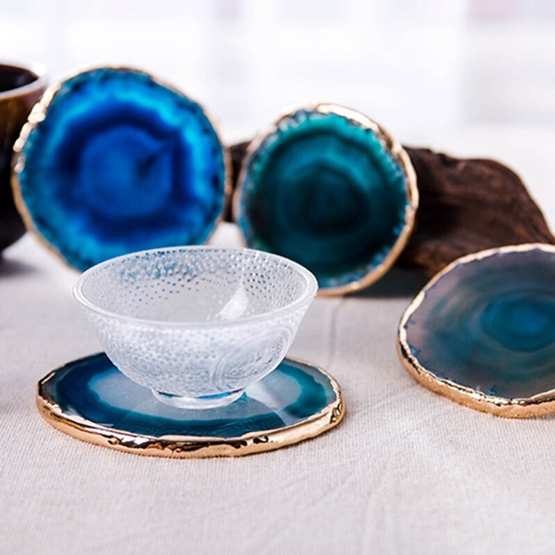Blue Agate Stone Coaster with Gold Rim holding glass bowl